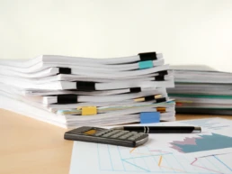 stacks documents table against light background